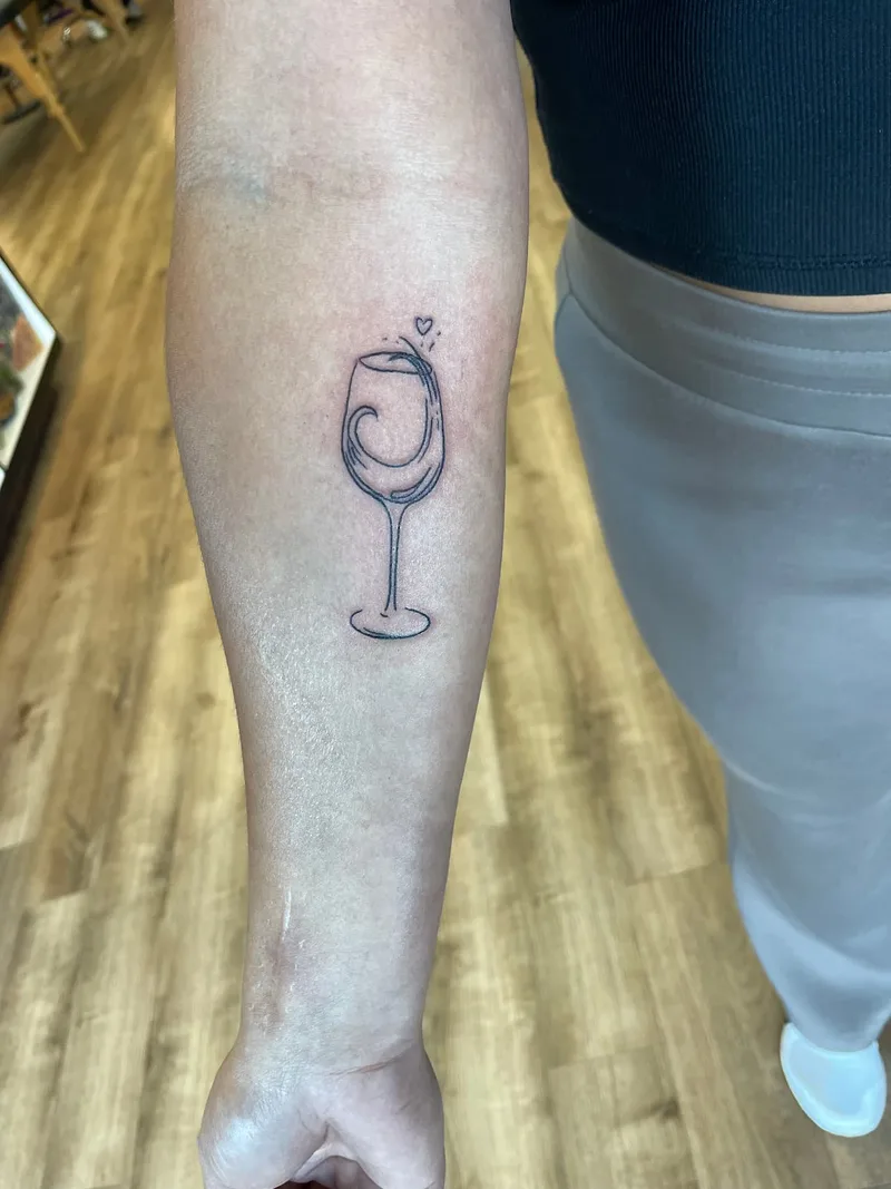 wine glass tattoo by Jesse at Sin on Skin