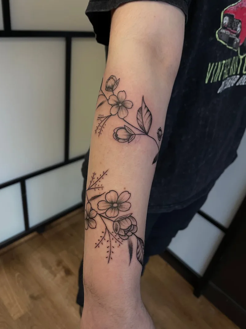 Floral wrapping th eforearm tattoo